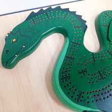Load image into Gallery viewer, Cribbage Board Ogopogo Handcrafted in BC by Andrew Riddle
