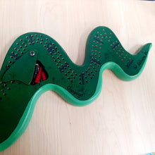 Load image into Gallery viewer, Cribbage Board Ogopogo Handcrafted in BC by Andrew Riddle
